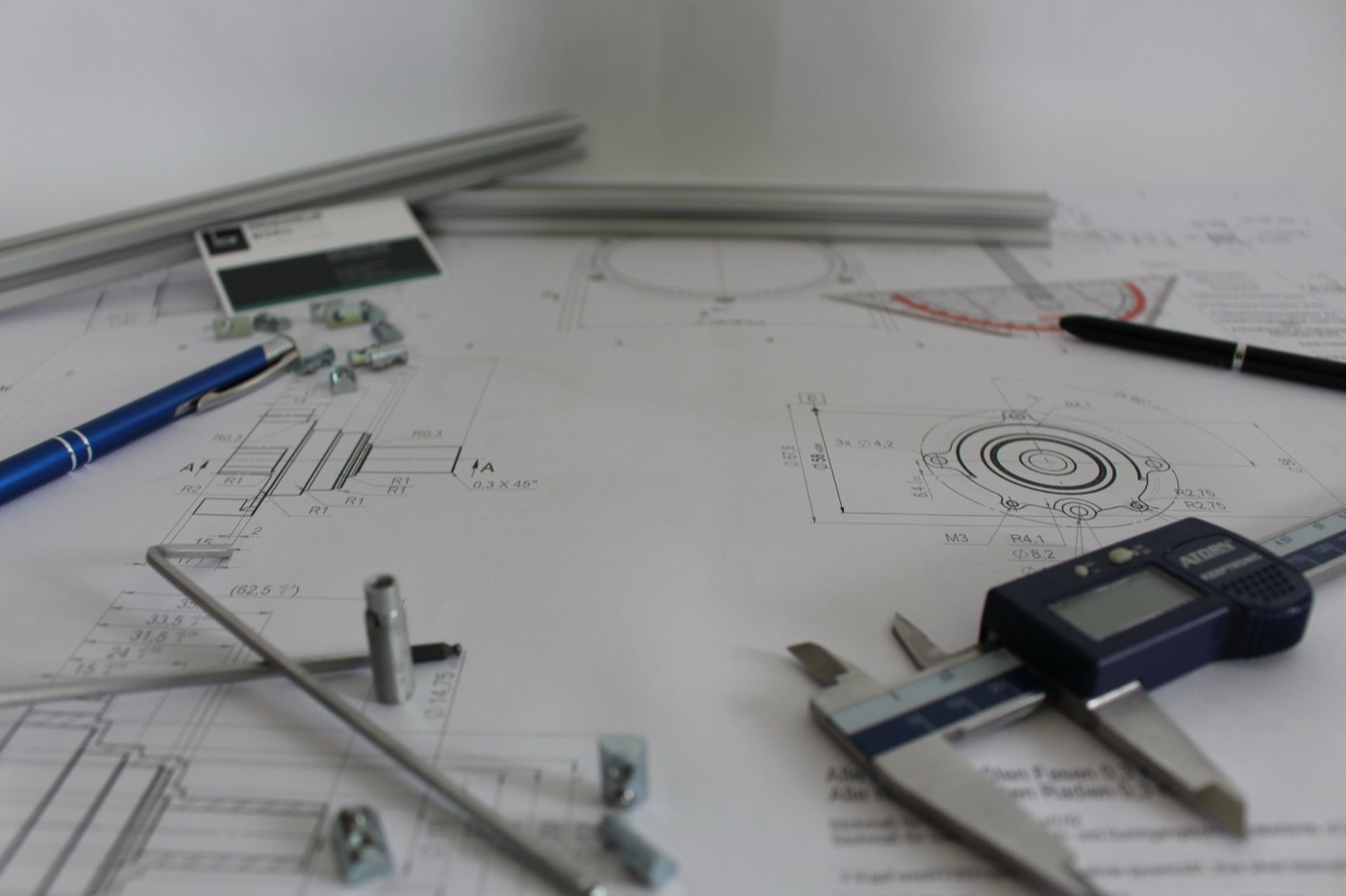 Engineering blueprint and precision parts