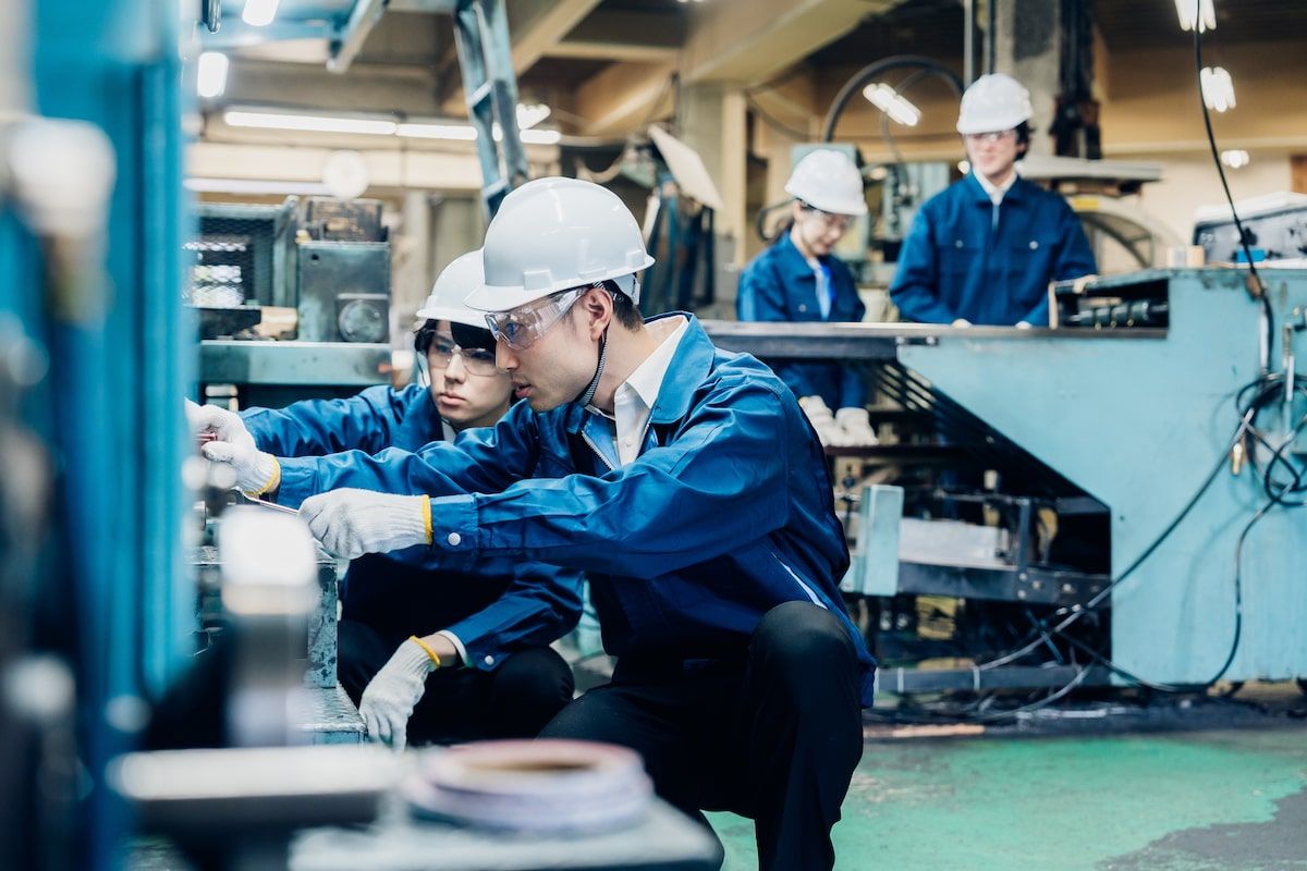 Engineers installing and commissioning equipment on the factory floor